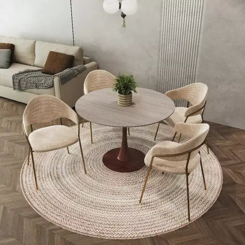 Table à manger ronde avec plateau en pierre frittée et piètement central en noyer et acier