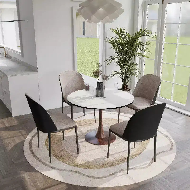Table à manger ronde avec plateau en pierre frittée et piètement central en noyer et acier