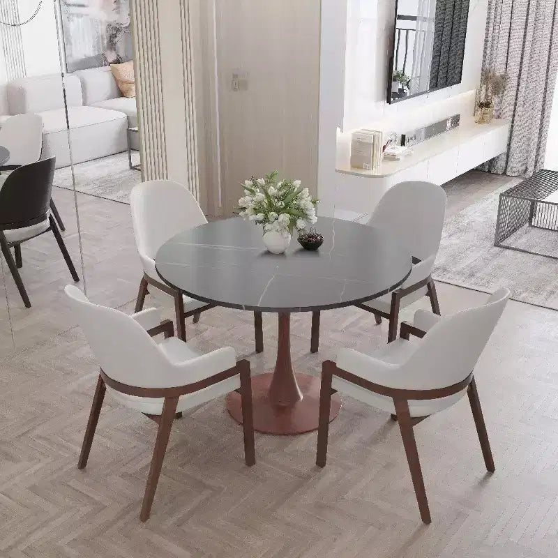 Table à manger ronde avec plateau en pierre frittée et piètement central en noyer et acier