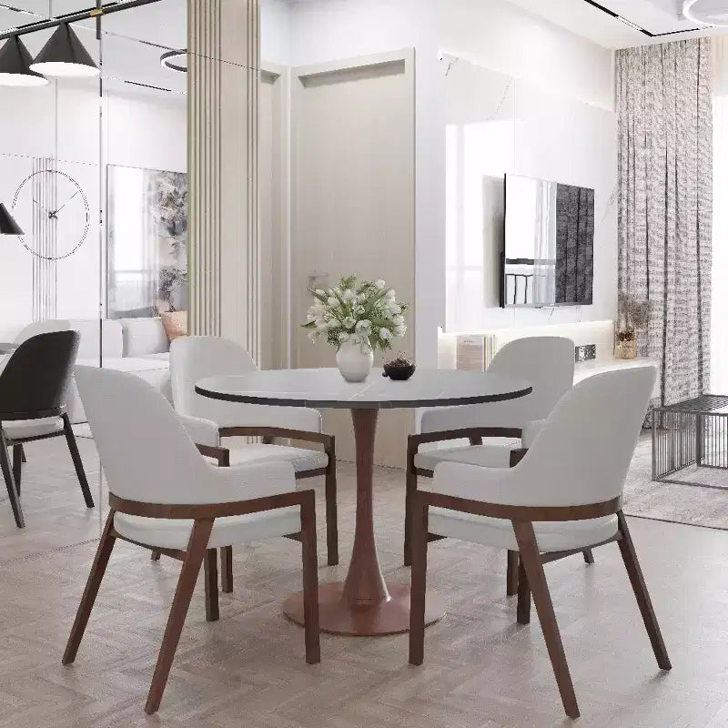 Table à manger ronde avec plateau en pierre frittée et piètement central en noyer et acier