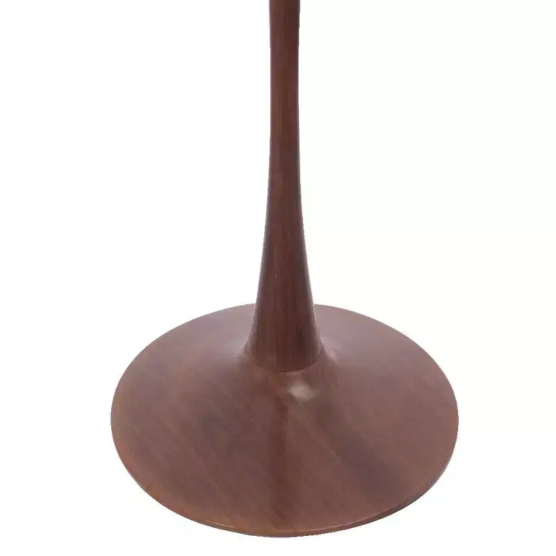 Table à manger ronde avec plateau en pierre frittée et piètement central en noyer et acier