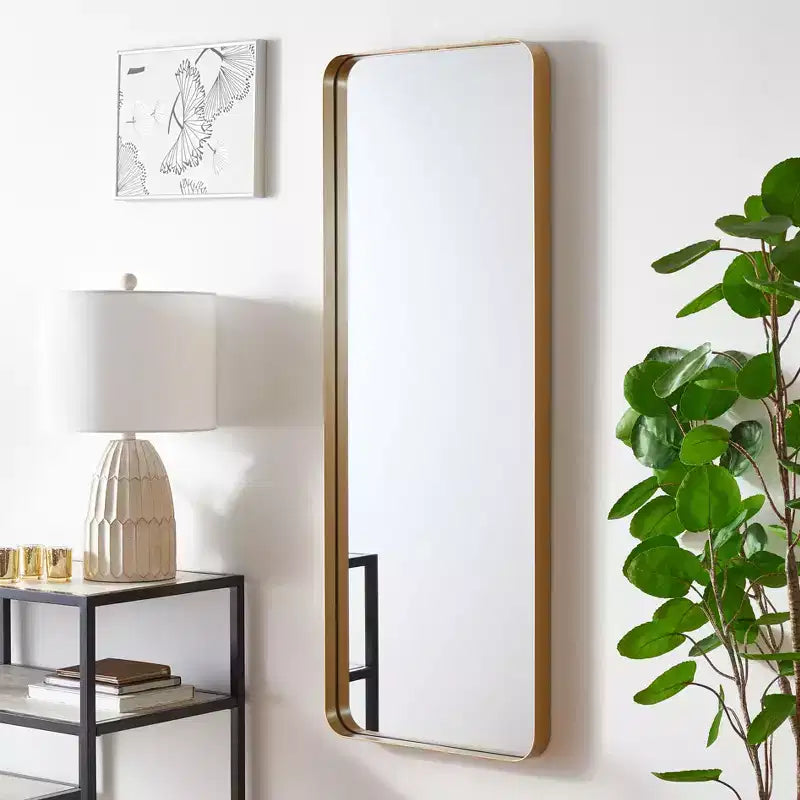 Miroir mural en fer doré